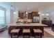 Bright kitchen with stainless steel appliances, large central island, granite countertops and pendant lighting at 3195 Bartee Walk, Suwanee, GA 30024