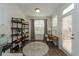 Bright office space with a modern desk, shelving, and a view of the outdoor space at 3195 Bartee Walk, Suwanee, GA 30024