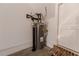 A close-up of a standard water heater inside the home in front of the utility door at 3195 Bartee Walk, Suwanee, GA 30024