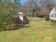 Spacious backyard with a view of neighboring houses, featuring a grassy area perfect for outdoor activities at 5121 Newark Ave, Clarkdale, GA 30111