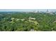 Aerial image highlighting Atlanta's skyline and trees in an upscale residential area at 663 Clifton Ne Rd, Atlanta, GA 30307