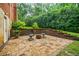 Paver patio, outdoor seating, and tiered garden beds at the back of the house at 663 Clifton Ne Rd, Atlanta, GA 30307