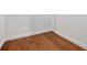 Clean, unfinished basement corner featuring hardwood floors and a fresh white paint at 663 Clifton Ne Rd, Atlanta, GA 30307