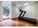Basement exercise area features hardwood floors and access to the outdoors at 663 Clifton Ne Rd, Atlanta, GA 30307
