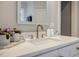 Bathroom vanity featuring marble countertop, stylish faucet, and decorative accessories at 663 Clifton Ne Rd, Atlanta, GA 30307