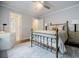 Bright bedroom with a ceiling fan, carpet, and an en suite bathroom at 663 Clifton Ne Rd, Atlanta, GA 30307
