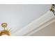 Close up of a ceiling with crown molding, recessed lighting, and a decorative chandelier at 663 Clifton Ne Rd, Atlanta, GA 30307