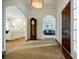 Elegant foyer with hardwood floors, leading to open living spaces with ample natural light and a classic grandfather clock at 663 Clifton Ne Rd, Atlanta, GA 30307