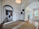 Welcoming foyer with arched doorways, hardwood floors, and sophisticated design elements at 663 Clifton Ne Rd, Atlanta, GA 30307