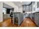 Modern kitchen with gray cabinetry, wine cooler, stainless appliances, and access to dining area at 663 Clifton Ne Rd, Atlanta, GA 30307