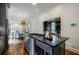 Spacious kitchen island with built-in appliances, granite countertop, and open view to the living spaces at 663 Clifton Ne Rd, Atlanta, GA 30307