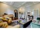 Spacious living room with a coffered ceiling, hardwood floors, and stylish furniture at 663 Clifton Ne Rd, Atlanta, GA 30307