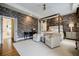 Spacious main bedroom with a four-poster bed, neutral decor, and an ensuite bathroom at 663 Clifton Ne Rd, Atlanta, GA 30307