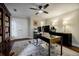 Bright office with modern desk, dual monitors, and ample storage, illuminated by a stylish ceiling fan at 663 Clifton Ne Rd, Atlanta, GA 30307