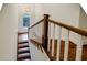 Staircase with hardwood treads, white risers, and a window view at 663 Clifton Ne Rd, Atlanta, GA 30307