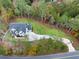 Aerial view of a modern home on a spacious lot with a long driveway at 1387 Mineral Springs Rd, Hoschton, GA 30548