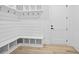 Mudroom with built-in bench and storage hooks at 1387 Mineral Springs Rd, Hoschton, GA 30548