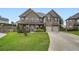 Beautiful brick home with a two-car garage and a well-maintained front yard at 5445 Whisper Ct, Cumming, GA 30028
