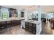 Spacious kitchen with stainless appliances, granite counters, and hardwood floors at 5445 Whisper Ct, Cumming, GA 30028