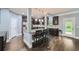 Open kitchen with stainless steel appliances and a granite island at 5445 Whisper Ct, Cumming, GA 30028