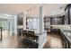 Gourmet kitchen featuring granite countertops, stainless steel appliances and center island with seating at 5445 Whisper Ct, Cumming, GA 30028