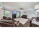 Spacious living room features a fireplace, hardwood floors, ceiling fan, and abundant natural light at 5445 Whisper Ct, Cumming, GA 30028