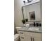 Bathroom featuring a modern vanity, granite countertop, updated fixtures, and neutral decor at 2349 Ousley Ct, Decatur, GA 30032
