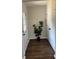 Welcoming entryway with hardwood floors, closet space, and a decorative plant feature at 2349 Ousley Ct, Decatur, GA 30032