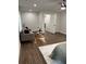 The living room area has hardwood floors, a ceiling fan, and a couch with accent pillows at 2349 Ousley Ct, Decatur, GA 30032