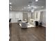 Spacious living room with hardwood floors, neutral furniture, modern lighting, and large windows at 2349 Ousley Ct, Decatur, GA 30032