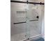 Modern shower featuring glass doors, stylish tile, and contemporary fixtures at 2349 Ousley Ct, Decatur, GA 30032