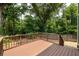 Large backyard deck perfect for entertaining, surrounded by mature trees and greenery at 2876 White Oak Dr, Decatur, GA 30032
