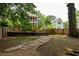 Secluded backyard featuring a stone pathway leading to the home with a multi-level deck at 2876 White Oak Dr, Decatur, GA 30032
