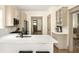 Elegant kitchen with white countertops, modern appliances, and bar stool seating at 2876 White Oak Dr, Decatur, GA 30032