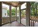 Inviting screened porch with wood flooring, offering views of the lush backyard at 2876 White Oak Dr, Decatur, GA 30032
