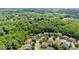Aerial view of a residential neighborhood surrounded by lush green trees at 4896 Locklear Way, Marietta, GA 30066