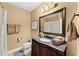 Traditional bathroom with granite vanity, framed mirror, and coordinated towel sets at 4896 Locklear Way, Marietta, GA 30066