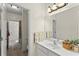 Bright bathroom features a large mirror, light fixtures, and white countertop at 4896 Locklear Way, Marietta, GA 30066