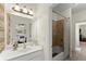 Clean bathroom features a framed mirror, soaking tub, and a shower with tile at 4896 Locklear Way, Marietta, GA 30066
