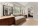 Bathroom featuring double sinks, tile floor, and soaking tub with tile surround at 4896 Locklear Way, Marietta, GA 30066