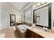 Bathroom featuring double sinks, tile floor, and tub with tile surround at 4896 Locklear Way, Marietta, GA 30066