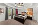 Cozy bedroom with a comfortable bed, ceiling fan, sports decor, and natural light at 4896 Locklear Way, Marietta, GA 30066
