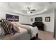 Well-lit bedroom featuring a comfortable bed, sports decor, and ample storage at 4896 Locklear Way, Marietta, GA 30066