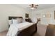 Comfortable bedroom has an expansive bed, dark wood furniture, and soothing decor at 4896 Locklear Way, Marietta, GA 30066