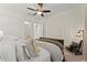 Bright bedroom featuring neutral tones, a ceiling fan and a comfortable, plush bed at 4896 Locklear Way, Marietta, GA 30066