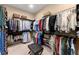 Spacious walk-in closet with ample storage and clothing racks, plus a center ottoman at 4896 Locklear Way, Marietta, GA 30066