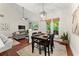 Open concept dining area flowing into the living room, featuring modern lighting and outdoor access at 4896 Locklear Way, Marietta, GA 30066