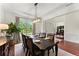 Spacious dining room with hardwood floors, wainscoting, and views into the office at 4896 Locklear Way, Marietta, GA 30066