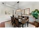 Elegant dining room with wainscoting, large windows, and statement lighting at 4896 Locklear Way, Marietta, GA 30066