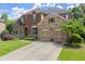 Charming two-story home with brick and stone exterior and well-manicured landscaping at 4896 Locklear Way, Marietta, GA 30066